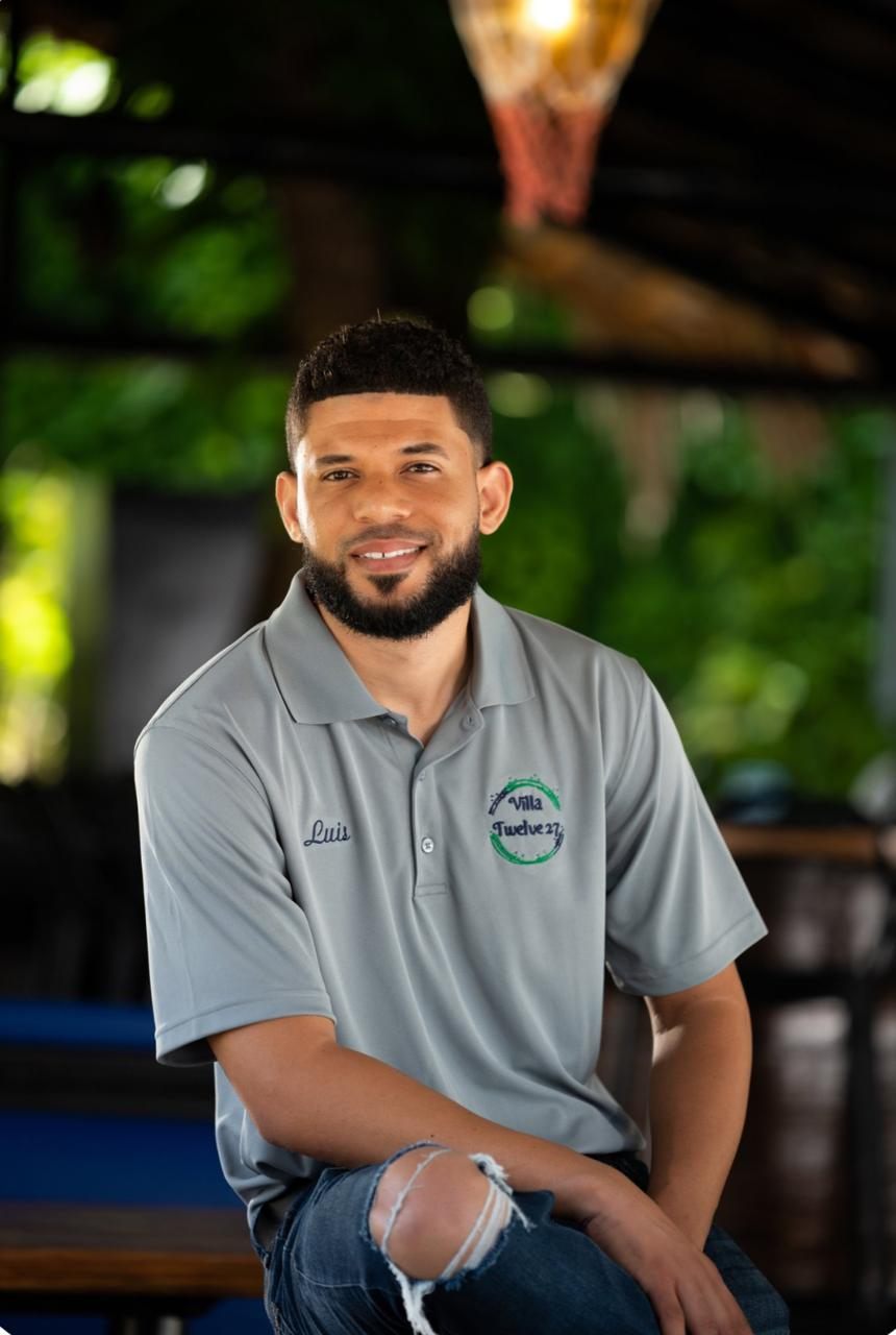 Luis, one of our drivers, smiling at a beachside lounge