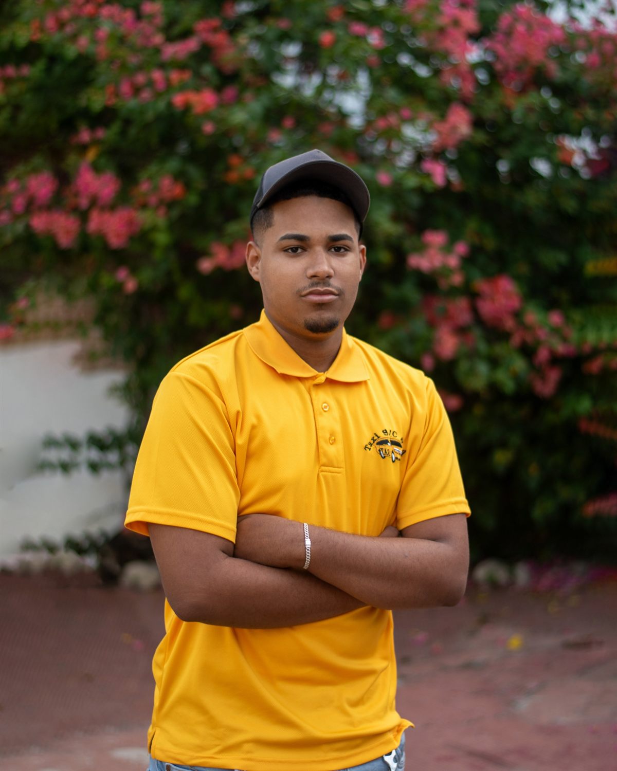 Sariel, one of our drivers, in the team's yellow taxi polo